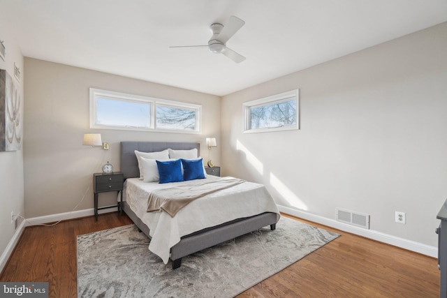 bedroom with ceiling fan and hardwood / wood-style flooring