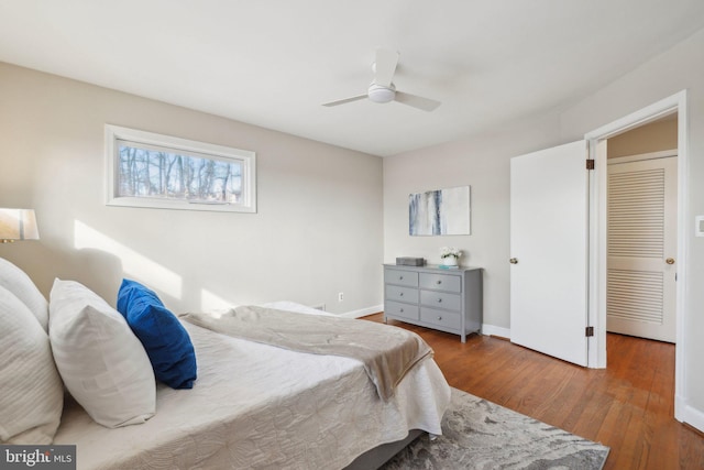 bedroom with ceiling fan and wood-type flooring