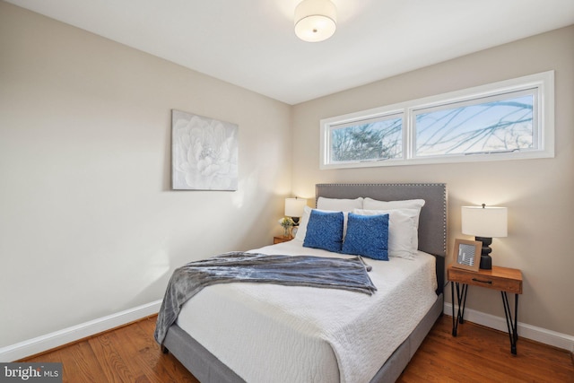 bedroom with hardwood / wood-style floors