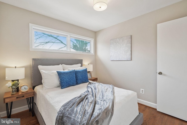 bedroom featuring dark hardwood / wood-style flooring