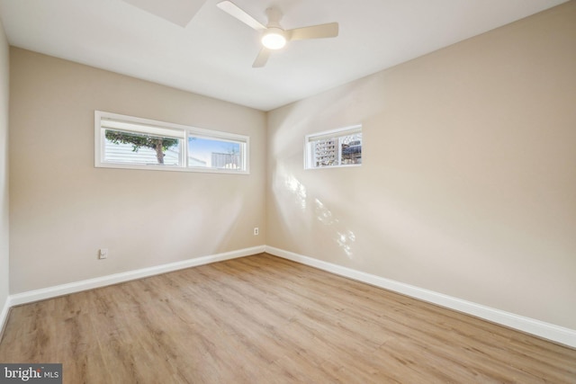 spare room with ceiling fan and light hardwood / wood-style flooring