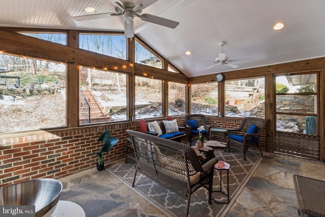 sunroom with lofted ceiling and ceiling fan