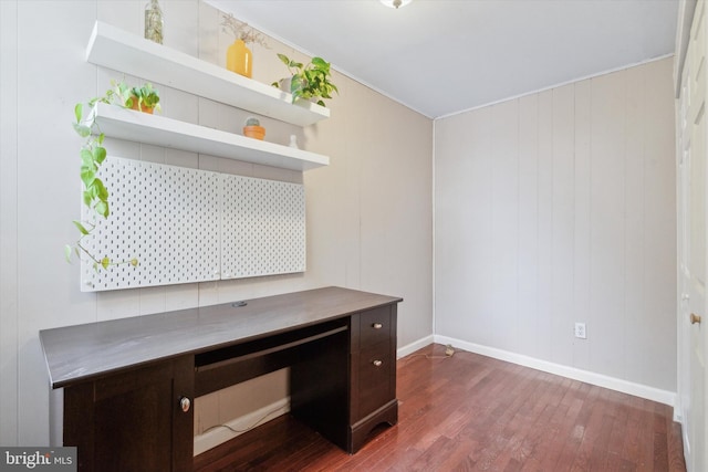 unfurnished office with dark wood-type flooring