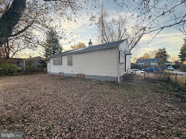 view of property exterior at dusk