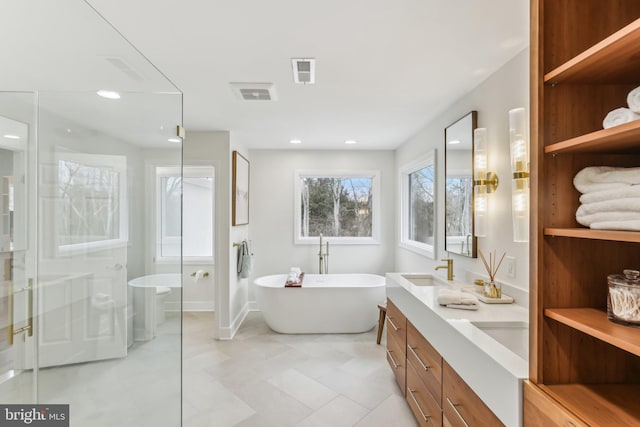 bathroom with vanity and plus walk in shower