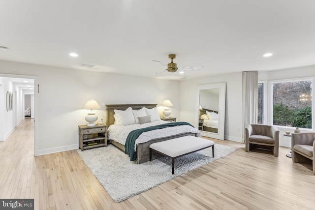 bedroom with ceiling fan and light hardwood / wood-style floors