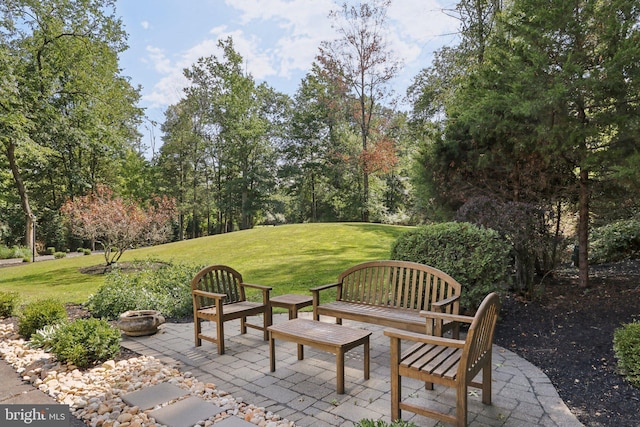 view of patio with a fire pit