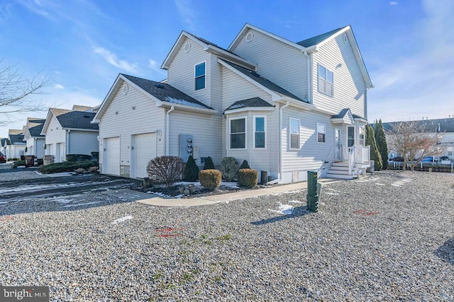 view of side of property with a garage