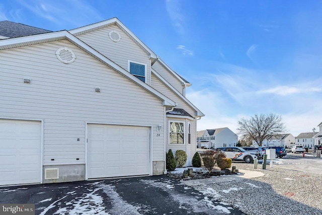 view of property exterior with a garage