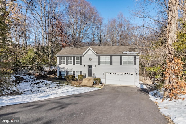 bi-level home featuring a garage