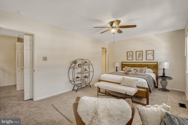 bedroom with light colored carpet and ceiling fan