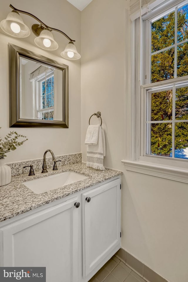 bathroom with tile patterned floors and vanity