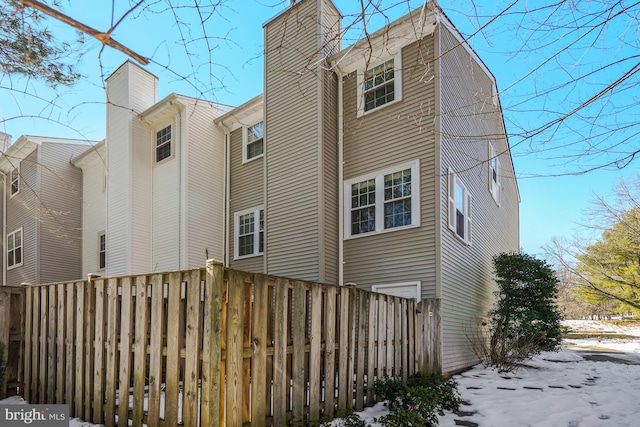 view of snow covered house