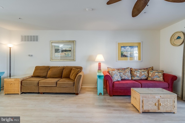 living room featuring ceiling fan and light wood-type flooring