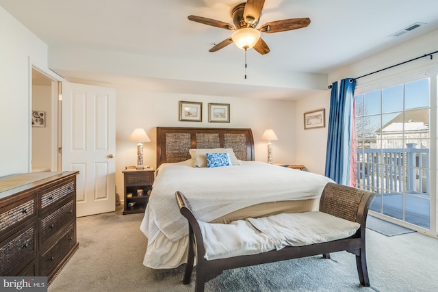 carpeted bedroom with ceiling fan and access to outside