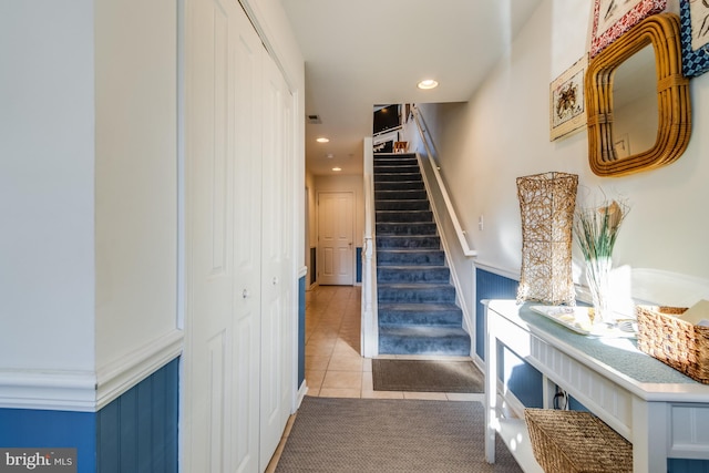 staircase featuring tile patterned floors