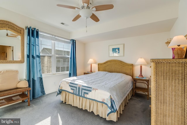 bedroom with ceiling fan and carpet