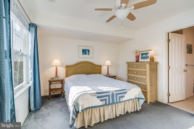 bedroom with ceiling fan and carpet