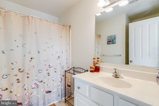 bathroom with vanity and tile patterned flooring