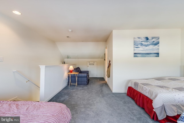 carpeted bedroom with vaulted ceiling