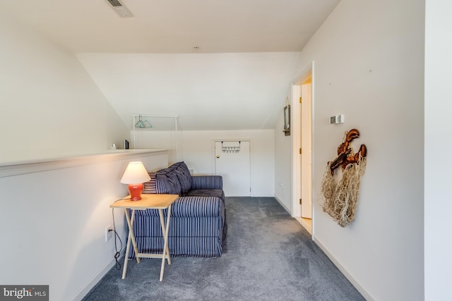 sitting room featuring dark colored carpet