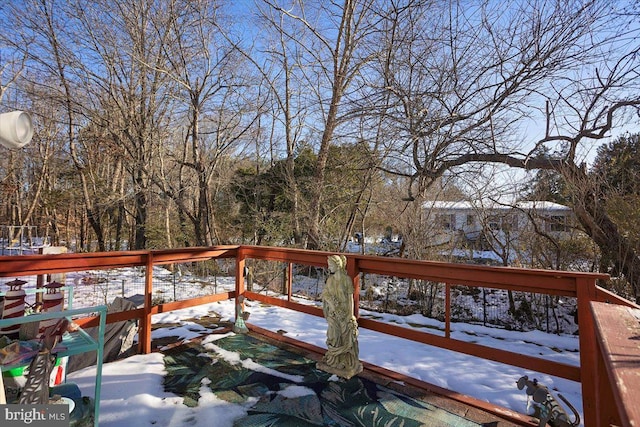 view of snow covered deck