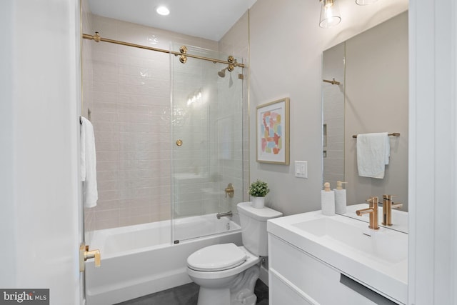 full bathroom with tiled shower / bath combo, toilet, and vanity