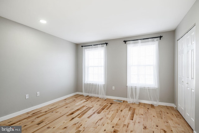 empty room with light wood-type flooring