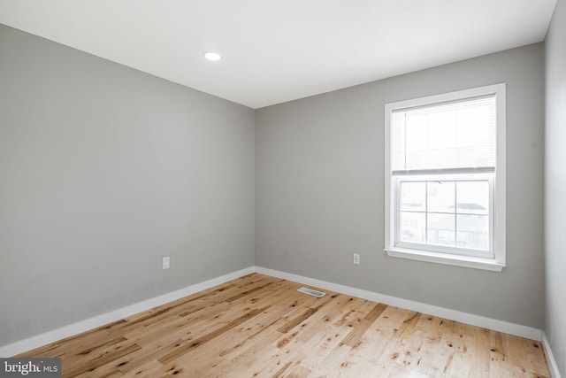 spare room with light wood-type flooring