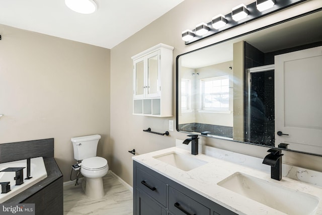 bathroom featuring toilet, an enclosed shower, and vanity