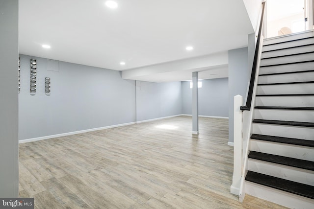 basement featuring light hardwood / wood-style flooring