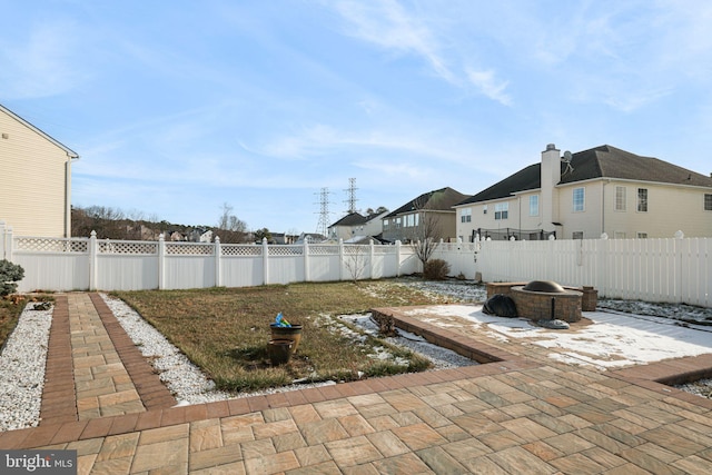 view of patio / terrace with a fire pit