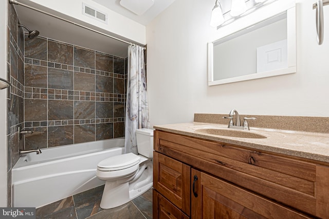 full bathroom featuring shower / tub combo with curtain, vanity, and toilet