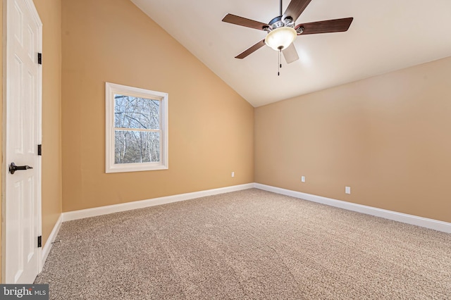 carpeted empty room featuring high vaulted ceiling and ceiling fan