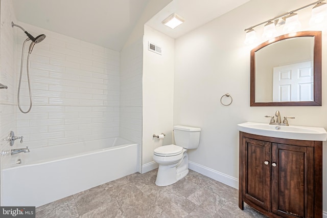 full bathroom with toilet, vanity, and tiled shower / bath