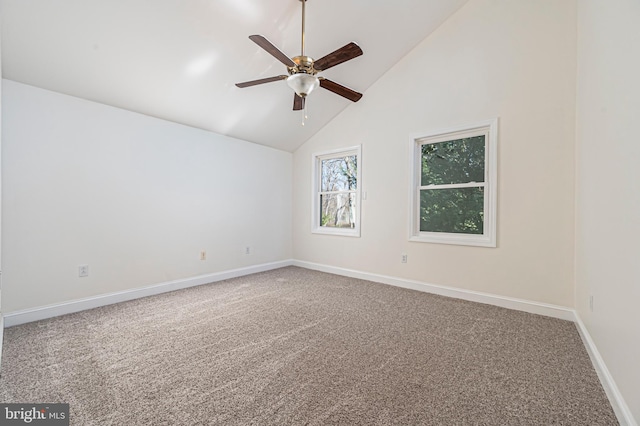 spare room featuring high vaulted ceiling, carpet floors, and ceiling fan