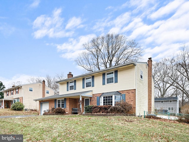 view of front facade with a front yard and a garage