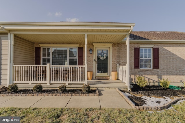 entrance to property with a porch