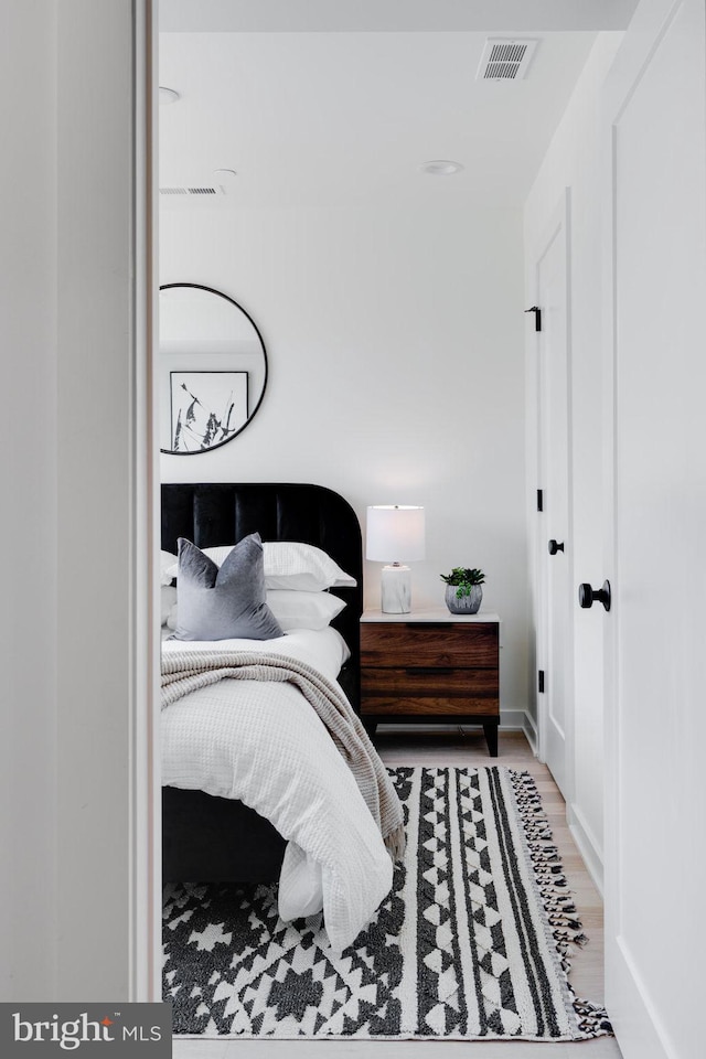 bedroom featuring hardwood / wood-style floors