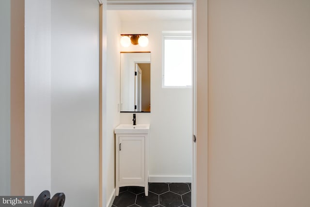 bathroom with tile patterned flooring and vanity