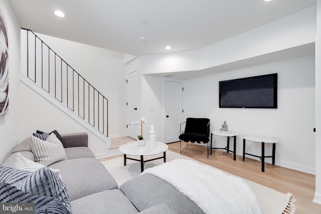 living room with light hardwood / wood-style flooring