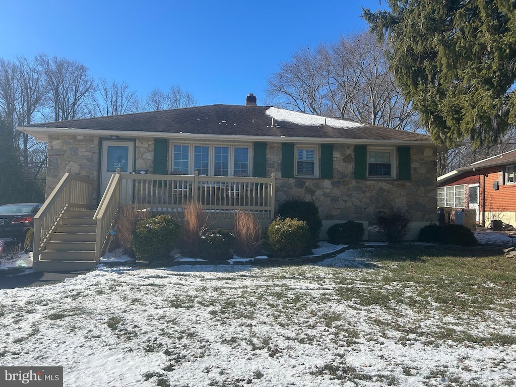 view of snow covered house