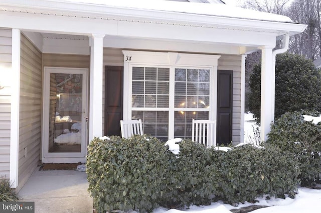 view of snow covered property entrance