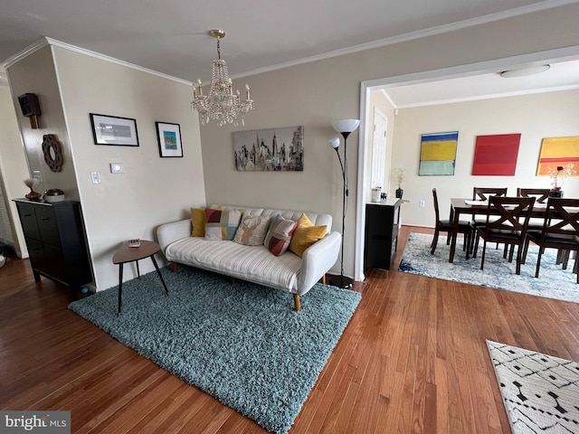 8107 Orville St, Alexandria, VA 22309 - living area with a chandelier, wood finished floors, crown molding, and baseboards