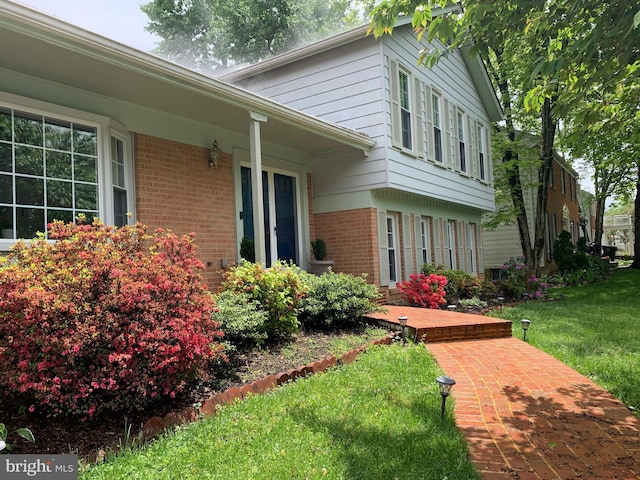 8107 Orville St, Alexandria, VA 22309 - exterior space with a lawn and brick siding