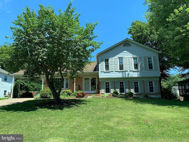 8107 Orville St, Alexandria, VA 22309 - view of front of property with a shingled roof, brick siding, and a front yard
