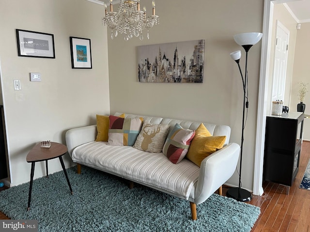 8107 Orville St, Alexandria, VA 22309 - living room featuring wood finished floors, baseboards, and a notable chandelier