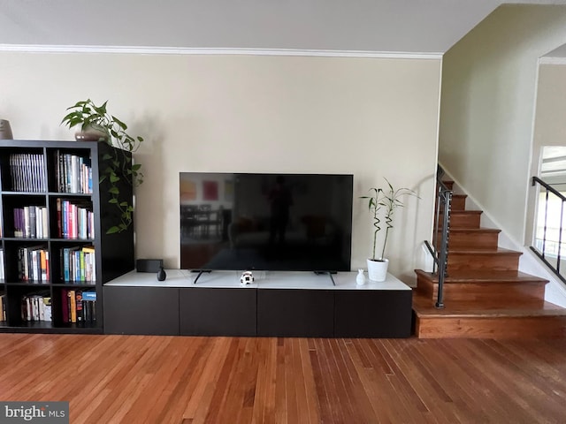 8107 Orville St, Alexandria, VA 22309 - living area featuring wood finished floors, stairs, and crown molding