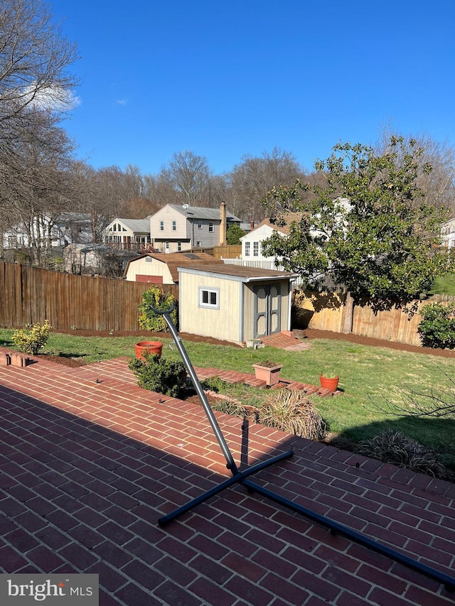 8107 Orville St, Alexandria, VA 22309 - view of patio / terrace featuring a storage shed, an outbuilding, and a fenced backyard