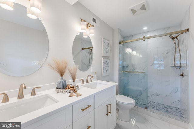 bathroom with toilet, an enclosed shower, and vanity